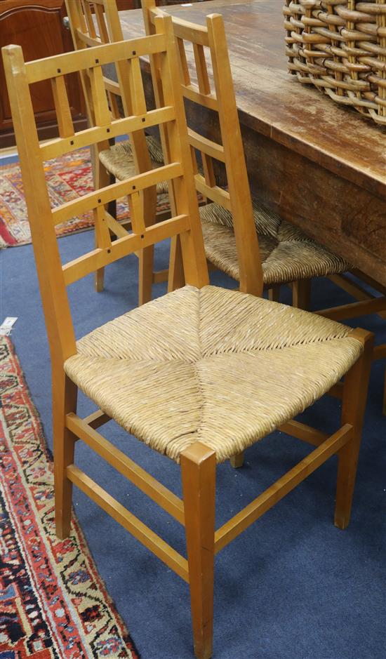 A set of six Macintosh influenced blond wood dining chairs, with rush seats